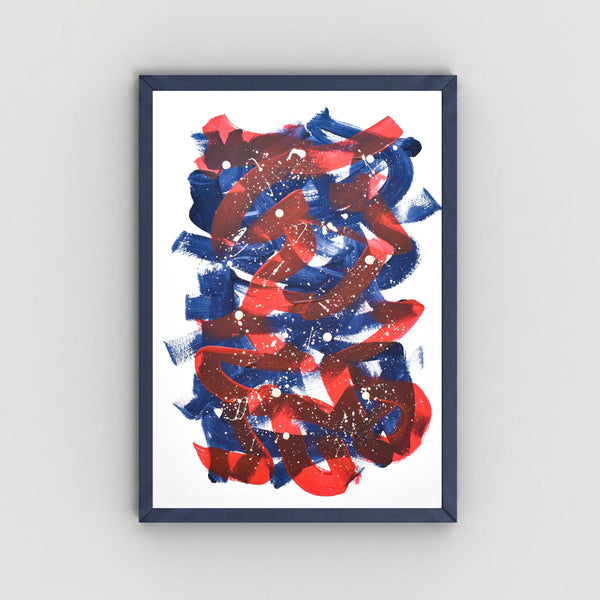 A framed abstract art featuring bold, expressive brushstrokes in red and blue with white paint splatters, set in a dark navy frame against a light gray wall.