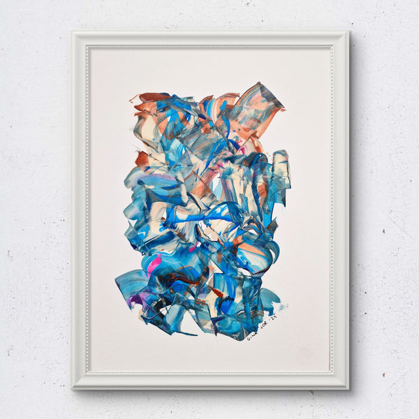 Framed abstract art piece with blue and pink colors on a white wall