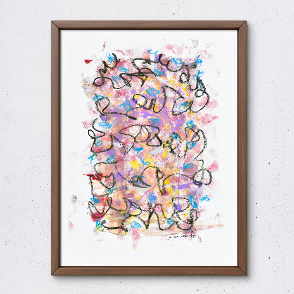 Framed abstract artwork with colorful patterns on a white wall