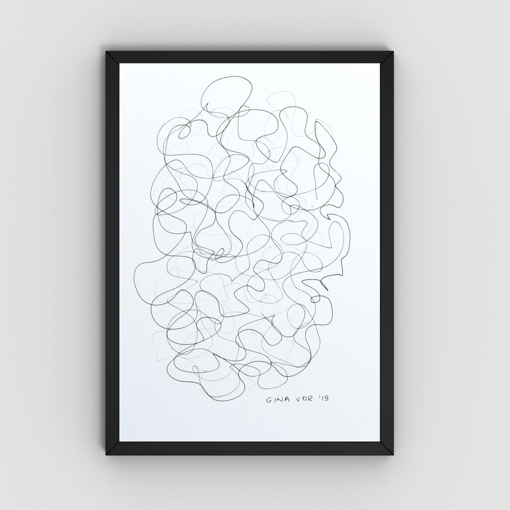 A framed abstract line art featuring a black continuous scribble pattern on a white background, enclosed in a slim black frame and mounted on a light gray wall.