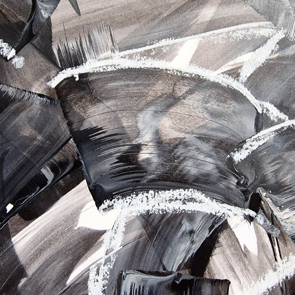 Close-up of an abstract artwork with black and gray colors