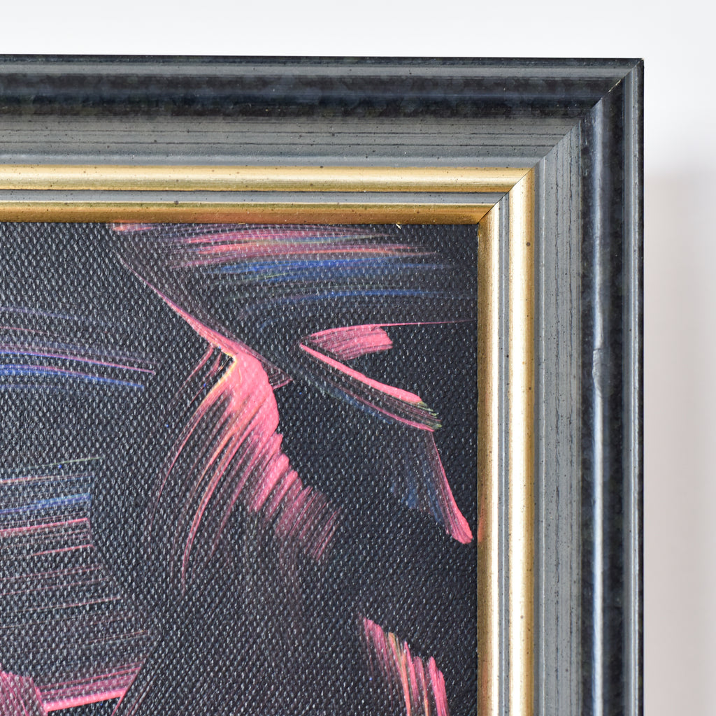 Abstract painting with pink and blue strokes in a gold and black frame.