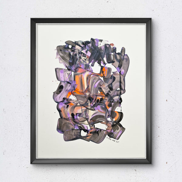 Framed abstract art on a textured white wall