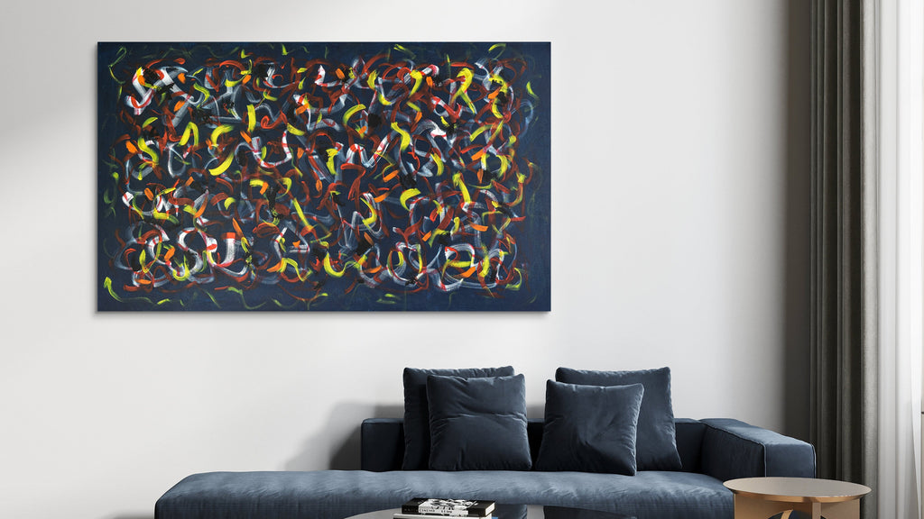 Abstract artwork with colorful patterns on a wall above a sofa in a living room.