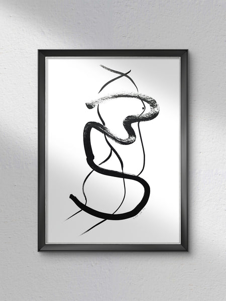Framed abstract black and white artwork on a gray wall