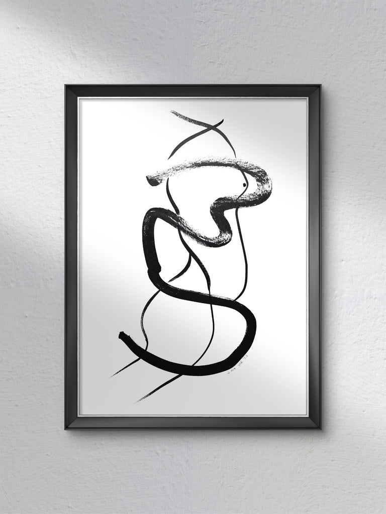 Framed abstract black and white artwork on a gray wall