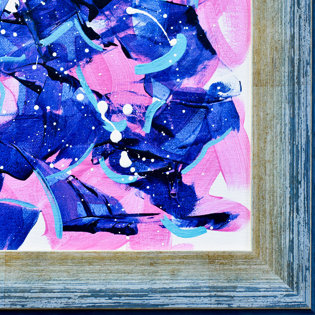 Abstract art piece with blue and pink colors in a wooden frame.