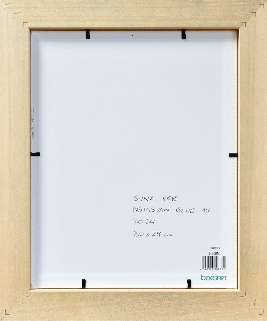Back view of a wooden picture frame with label inside
