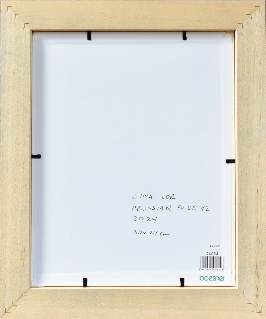 Back of the artwork, wooden picture frame with white mat and text on a white background