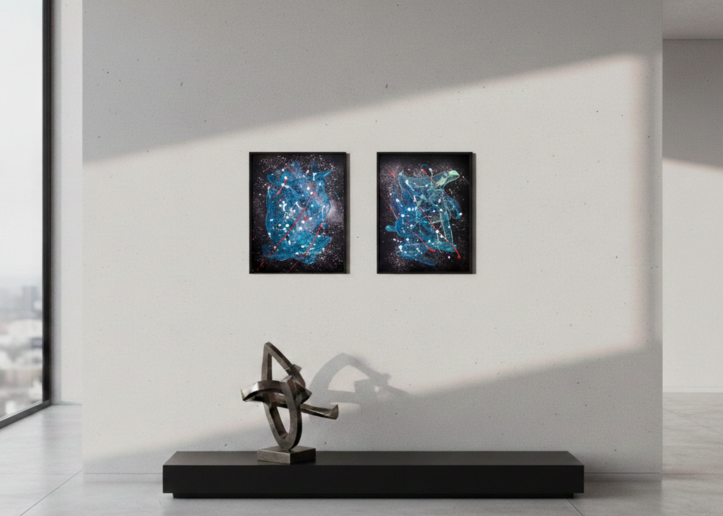 Two abstract paintings on a wall with a modern sculpture in the foreground.