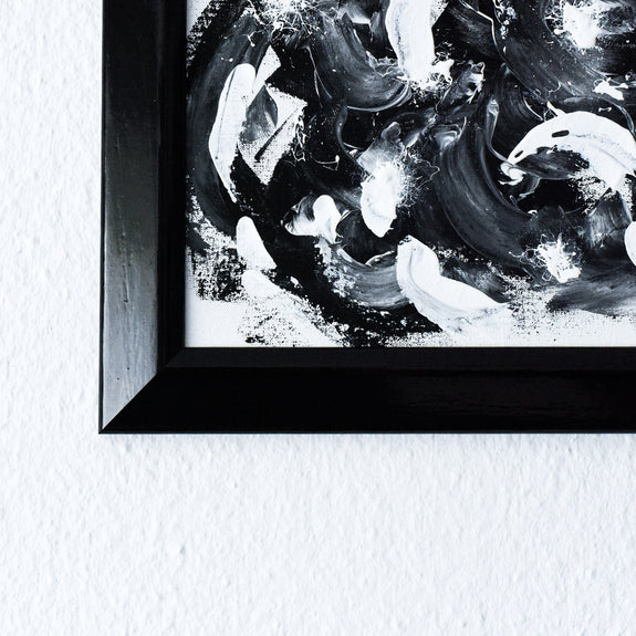 Framed black and white abstract painting
